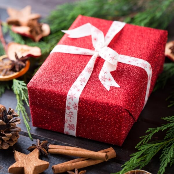 christmas-gift-on-the-antique-wooden-background-2023-11-27-05-10-24-utc-1.jpg
