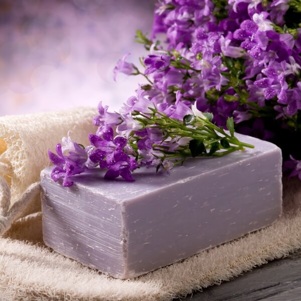 natural-flower-soap-with-scrub-sponge-spa-concept-2023-11-27-04-53-47-utc-1.jpg