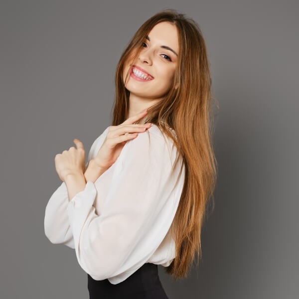 smiling-woman-in-pencil-skirt-and-blouse-standing-2024-02-12-15-59-39-utc-1.jpg